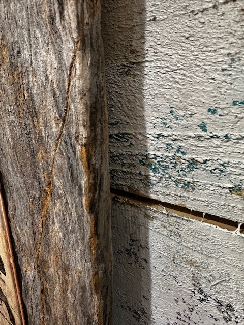 Metal Sign of Smith & Wesson Guns Mounted on Barnwood