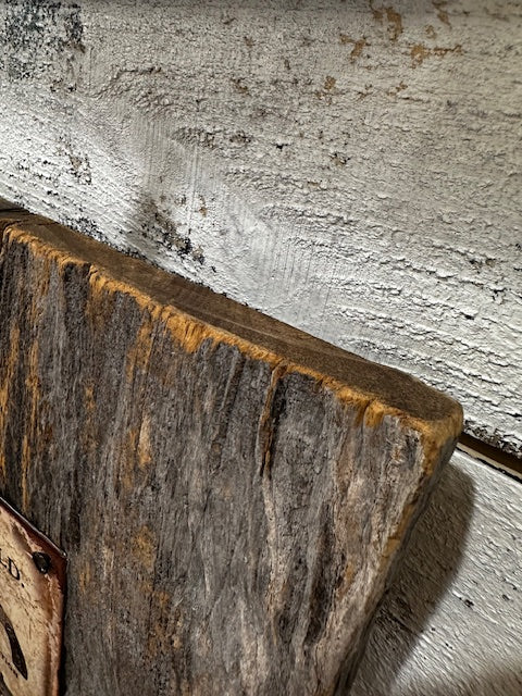 Metal Sign of Smith & Wesson Guns Mounted on Barnwood