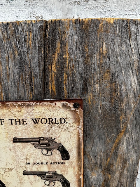 Metal Sign of Smith & Wesson Guns Mounted on Barnwood