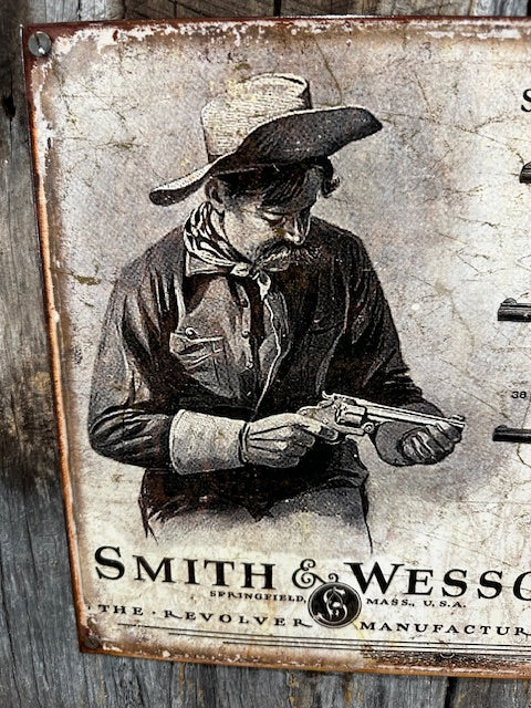 Metal Sign of Smith & Wesson Guns Mounted on Barnwood